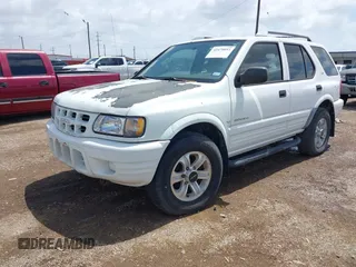 2001 Isuzu Rodeo S z VIN 4S2CK58W414357404, wystawiony jako IAAI lot #42479053 z przebiegiem Nie podano mil oraz . Historia ofert i sprzedaży dostępna na DreamBid. Obrazek 2.