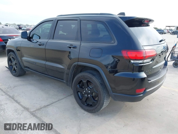 2018 Jeep Grand Cherokee Altitude with VIN 1C4RJFAG9JC436848, listed as a IAAI auction lot 42303459 with 124,044 mi miles and . Bid and sale history available at DreamBid. Image 3.