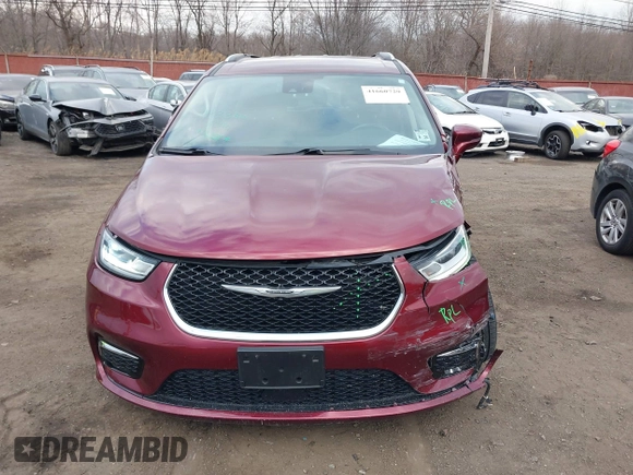 2021 Chrysler Pacifica Touring L with VIN 2C4RC1BG6MR597911, listed as a IAAI auction lot 41660729 with 72,004 mi miles and . Bid and sale history available at DreamBid. Image 12.