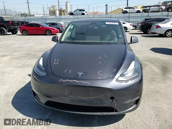 2024 Tesla Model Y Long Range z VIN 7SAYGDEE5RA244641, wystawiony jako Copart lot #51864845 z przebiegiem 23 096 mil mil oraz Szkoda całkowita • Salvage title. Historia ofert i sprzedaży dostępna na DreamBid. Obrazek 12.