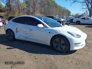 2020 Tesla Model 3 Standard Range Plus with VIN 5YJ3E1EA0LF783672, listed as a IAAI auction lot 41903431 with 52,157 mi miles and . Bid and sale history available at carsss.com. Image 13.