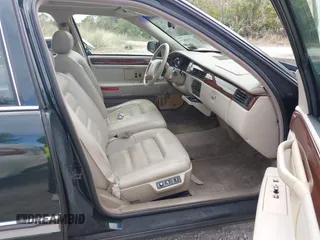 1996 Cadillac DeVille z VIN 1G6KF5298TU269234, wystawiony jako IAAI lot #41345945 z przebiegiem 34 218 mil mil oraz . Historia ofert i sprzedaży dostępna na DreamBid. Obrazek 5.