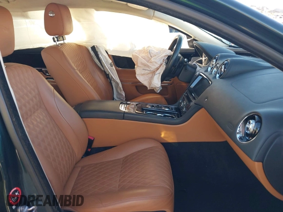 2019 Jaguar XJ Portfolio with VIN SAJWA2G70K8W18172, listed as a IAAI auction lot 41301895 with 13,037 mi miles and . Bid and sale history available at DreamBid. Image 5.