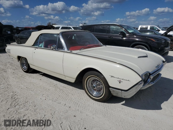 1961 Ford Thunderbird with VIN 1Y73Z112797, listed as a Copart auction lot 77574894 with 22,246 mi miles and Salvage Title. Bid and sale history available at DreamBid. Image 4.