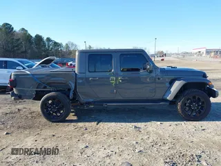 2022 Jeep Gladiator High Altitude with VIN 1C6HJTFGXNL124571, listed as a IAAI auction lot 41272140 with 14,198 mi miles and . Bid and sale history available at DreamBid. Image 14.
