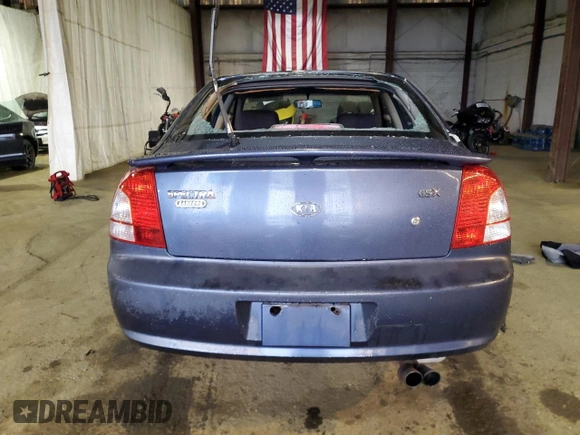 2003 Kia Spectra GS z VIN KNAFB161135104592, wystawiony jako Copart lot #52097205 z przebiegiem 119 206 mil mil oraz Szkoda całkowita • Salvage title. Historia ofert i sprzedaży dostępna na DreamBid. Obrazek 6.