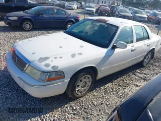 2004 Mercury Grand Marquis GS z VIN 2MEFM74W74X654151, wystawiony jako IAAI lot #42185493 z przebiegiem 203 017 mil mil oraz . Historia ofert i sprzedaży dostępna na DreamBid. Obrazek 2.