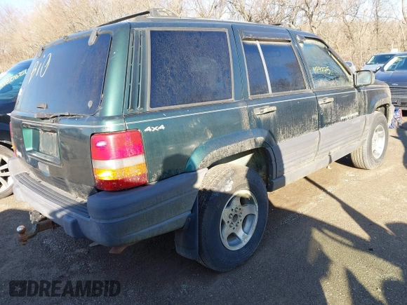1997 Jeep Grand Cherokee Laredo with VIN 1J4GZ58S2VC605385, listed as a IAAI auction lot 41797715 with 169,996 mi miles and . Bid and sale history available at DreamBid. Image 4.