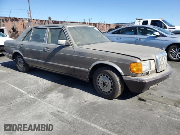 1989 Mercedes-Benz 560 with VIN WDBCA39D7KA428953, listed as a Copart auction lot 80856634 with 243,871 mi miles and Clean Title. Bid and sale history available at DreamBid. Image 4.