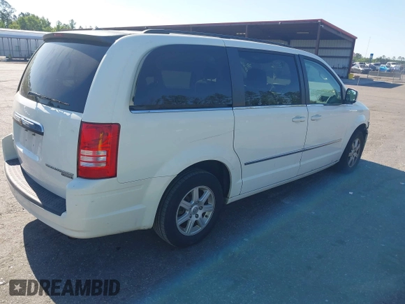 2010 Chrysler Town & Country Touring with VIN 2A4RR5D11AR493086, listed as a IAAI auction lot 42012604 with 154,204 mi miles and . Bid and sale history available at DreamBid. Image 4.