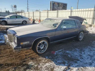 1984 Cadillac Eldorado z VIN 1G6AL5789EE639804, wystawiony jako Copart lot #41881585 z przebiegiem 83 483 mil mil oraz Szkoda całkowita • Salvage title. Historia ofert i sprzedaży dostępna na DreamBid. Obrazek 1.