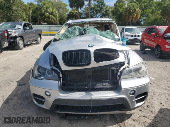 2012 BMW X5 35d with VIN 5UXZW0C51CL668064, listed as a Copart auction lot 62217845 with 140,544 mi miles and Salvage title. Bid and sale history available at DreamBid. Image 5.