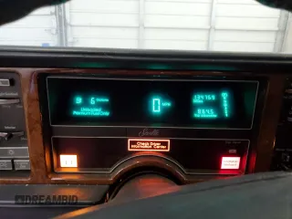 1991 Cadillac Seville z VIN 1G6KS53B2MU809384, wystawiony jako Copart lot #77185134 z przebiegiem 134 769 mil mil oraz Szkody całkowita. Historia ofert i sprzedaży dostępna na DreamBid. Obrazek 9.