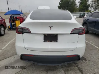 2021 Tesla Model Y Long Range with VIN 5YJYGDEE3MF214823, listed as a Copart auction lot 50738045 with 63,227 mi miles and Salvage Title. Bid and sale history available at DreamBid. Image 6.