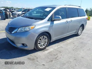 2015 Toyota Sienna XLE with VIN 5TDYK3DC3FS631916, listed as a IAAI auction lot 42043495 with 76,986 mi miles and . Bid and sale history available at DreamBid. Image 2.