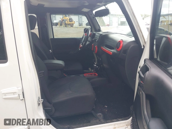 2014 Jeep Wrangler Unlimited Sport with VIN 1C4BJWDG9EL135077, listed as a IAAI auction lot 42324775 with 104,221 mi miles and . Bid and sale history available at DreamBid. Image 5.