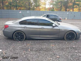 2016 BMW 6 Series 640i xDrive with VIN WBA6D2C50GGT66007, listed as a IAAI auction lot 40673899 with 73,695 mi miles. Bid and sale history available at carsss.com. Image 13.