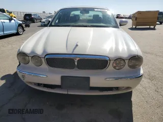 2005 Jaguar XJ with VIN SAJWA79C35SG48607, listed as a Copart auction lot 77132444 with 159,051 mi miles and Salvage Title. Bid and sale history available at carsss.com. Image 5.