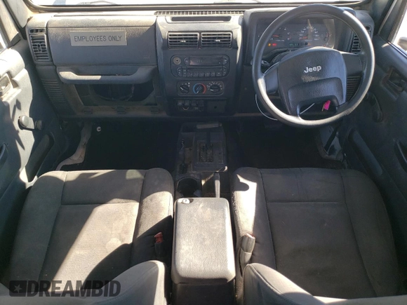 2006 Jeep Wrangler Sport Right Hand Drive with VIN 1J4F449S76P747454, listed as a Copart auction lot 77819214 with 184,763 mi miles and Salvage Title. Bid and sale history available at carsss.com. Image 8.