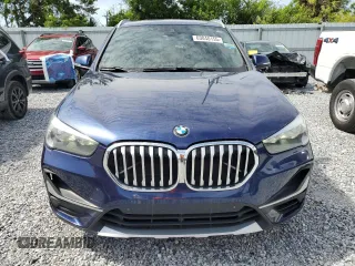 2020 BMW X1 xDrive28i with VIN WBXJG9C0XL5R33141, listed as a Copart auction lot 63040155 with 165,172 mi miles and Clean title. Bid and sale history available at DreamBid. Image 5.