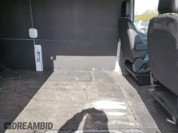 2023 Ford Transit Cargo с VIN 1FTBR2CG6PKA87002, выставлен на аукционе Copart как лот 75418304 с пробегом 24 240 миль миль и Списание • Salvage title. История ставок и продаж доступна на DreamBid. Изображение 11.