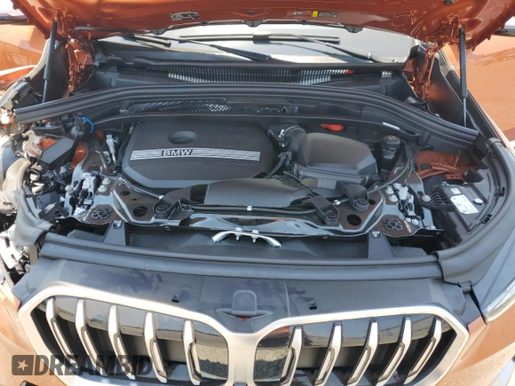 2023 BMW X1 xDrive28i with VIN WBX73EF03P5W54209, listed as a Copart auction lot 64796365 with 19,591 mi miles and Salvage title. Bid and sale history available at DreamBid. Image 12.