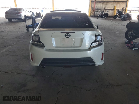 2015 Scion tC z VIN JTKJF5C70FJ003274, wystawiony jako Copart lot #53675415 z przebiegiem 83 326 mil mil oraz Szkoda całkowita • Salvage title. Historia ofert i sprzedaży dostępna na DreamBid. Obrazek 6.