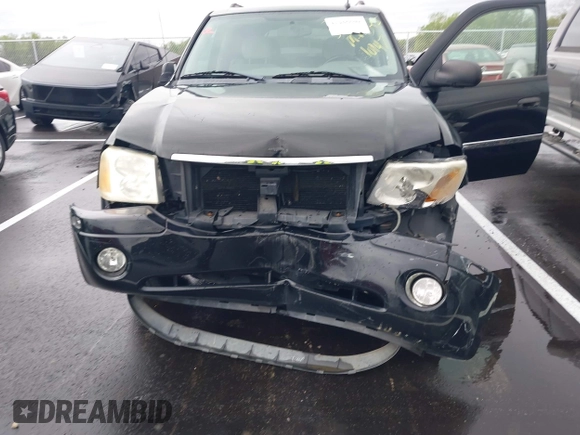 2007 GMC Envoy SLE with VIN 1GKDS13S872309605, listed as a IAAI auction lot 41946509 with 184,638 mi miles. Bid and sale history available at carsss.com. Image 6.