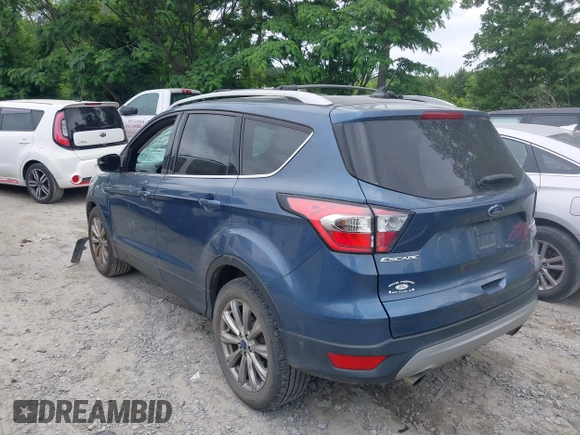 2018 Ford Escape Titanium with VIN 1FMCU0J99JUA12717, listed as a IAAI auction lot 42237509 with 123,896 mi miles and . Bid and sale history available at DreamBid. Image 3.