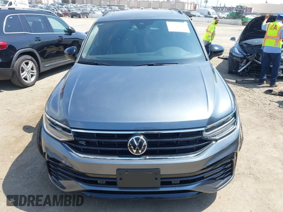 2023 Volkswagen Tiguan SE R-Line Black with VIN 3VVCB7AX8PM036684, listed as a IAAI auction lot 42169004 with 25,024 mi miles and . Bid and sale history available at DreamBid. Image 11.