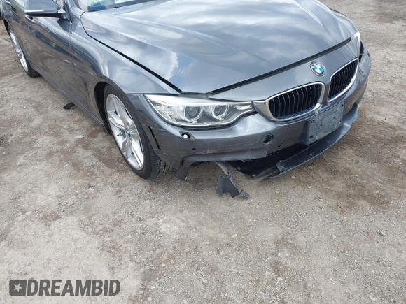 2015 BMW 4 Series 428i xDrive z VIN WBA4A7C5XFD415131, wystawiony jako IAAI lot #42100618 z przebiegiem 89 093 mil mil oraz . Historia ofert i sprzedaży dostępna na DreamBid. Obrazek 6.