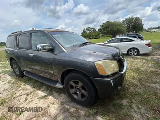 2005 Nissan Armada LE z VIN 5N1AA08A45N703735, wystawiony jako Copart lot #59034285 z przebiegiem 242 012 mil mil oraz Tytuł czysty. Historia ofert i sprzedaży dostępna na DreamBid. Obrazek 1.