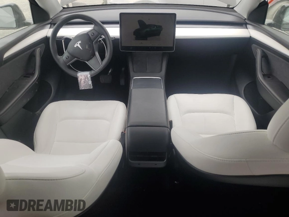 2023 Tesla Model Y Long Range with VIN 7SAYGAEE0PF642810, listed as a Copart auction lot 52181655 with 74,922 mi miles and Salvage Title. Bid and sale history available at DreamBid. Image 8.