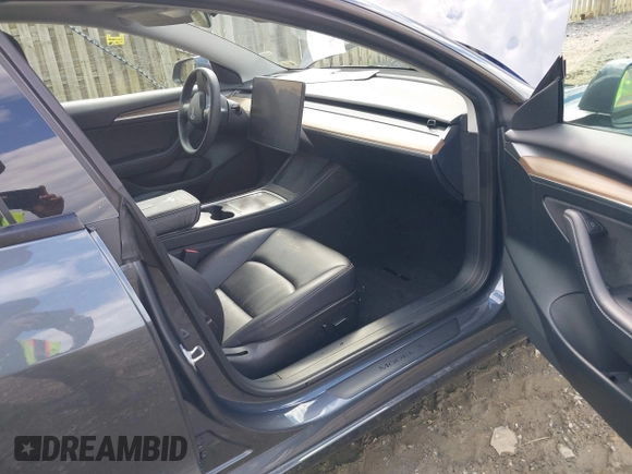 2023 Tesla Model 3 with VIN 5YJ3E1EA4PF515844, listed as a IAAI auction lot 42321123 with 46,683 mi miles and . Bid and sale history available at DreamBid. Image 5.