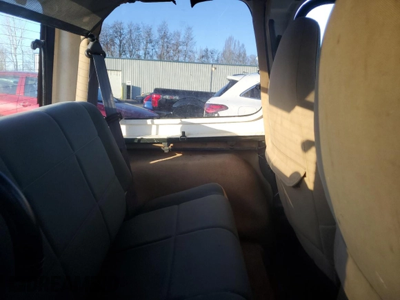 1998 Jeep Wrangler Sahara z VIN 1J4FY49S5WP798505, wystawiony jako Copart lot #88394465 z przebiegiem Nie podano mil oraz Szkoda całkowita • Salvage title. Historia ofert i sprzedaży dostępna na DreamBid. Obrazek 10.