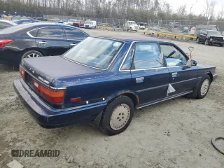 1989 Toyota Camry z VIN 4T1SV22E0KU032677, wystawiony jako Copart lot #46308555 z przebiegiem 993 896 mil mil oraz Czysty tytuł • Clean title. Historia ofert i sprzedaży dostępna na DreamBid. Obrazek 3.