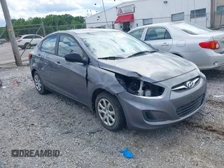 2014 Hyundai Accent GLS with VIN KMHCT4AE6EU670895, listed as a IAAI auction lot 42197066 with 142,983 mi miles. Bid and sale history available at carsss.com. Image 1.
