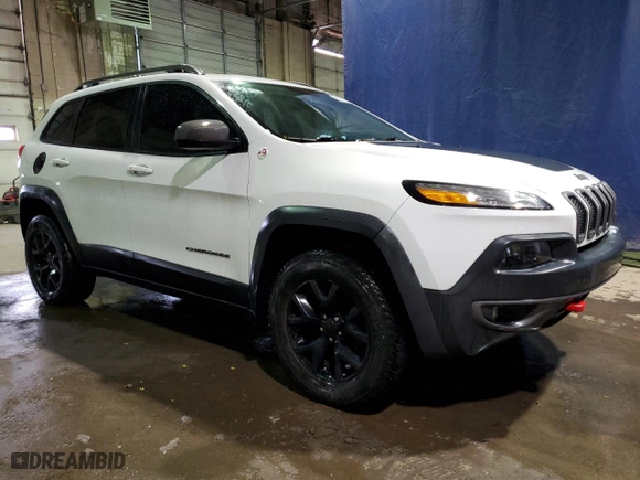 2015 Jeep Cherokee Trailhawk with VIN 1C4PJMBS7FW609741, listed as a Copart auction lot 42336145 with 125,711 mi miles and Clean Title. Bid and sale history available at carsss.com. Image 4.