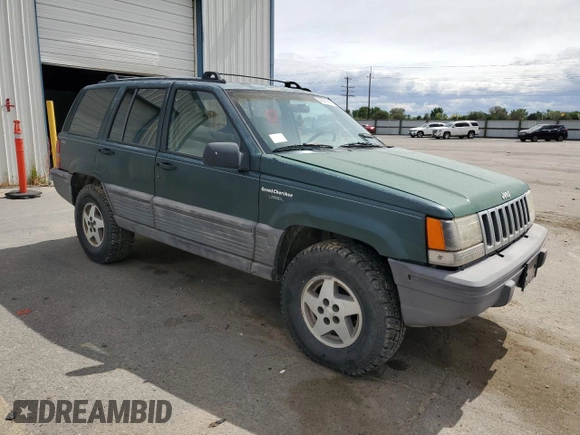 1993 Jeep Grand Cherokee Laredo with VIN 1J4GZ58Y8PC513026, listed as a Copart auction lot 57001465 with 135,242 mi miles and Clean title. Bid and sale history available at DreamBid. Image 4.