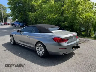 2012 BMW 6 Series 650i z VIN WBALZ3C55CDL70608, wystawiony jako Copart lot #59791605 z przebiegiem 97 077 mil mil oraz Czysty tytuł • Clean title. Historia ofert i sprzedaży dostępna na DreamBid. Obrazek 3.