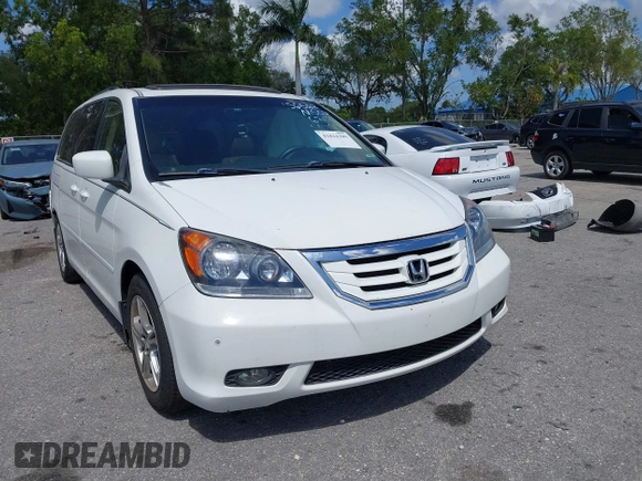 2008 Honda Odyssey Touring with VIN 5FNRL38858B006304, listed as a IAAI auction lot 41814309 with 208,778 mi miles. Bid and sale history available at carsss.com. Image 12.