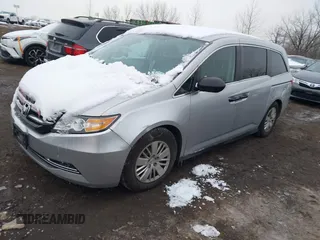 2014 Honda Odyssey LX with VIN 5FNRL5H22EB080346, listed as a IAAI auction lot 41282783 with 101,000 mi miles and . Bid and sale history available at carsss.com. Image 18.
