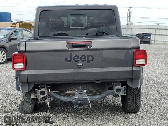 2023 Jeep Gladiator Freedom with VIN 1C6JJTAG9PL557861, listed as a Copart auction lot 50452955 with 44,716 mi miles and Salvage title. Bid and sale history available at DreamBid. Image 6.