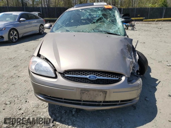 2003 Ford Taurus SEL Deluxe with VIN 1FAHP56SX3G199970, listed as a Copart auction lot 53042795 with 212,802 mi miles and Salvage Title. Bid and sale history available at DreamBid. Image 5.