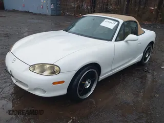 2002 Mazda MX-5 Miata Cloth z VIN JM1NB353420221527, wystawiony jako IAAI lot #41909623 z przebiegiem 90 260 mil mil oraz . Historia ofert i sprzedaży dostępna na DreamBid. Obrazek 2.