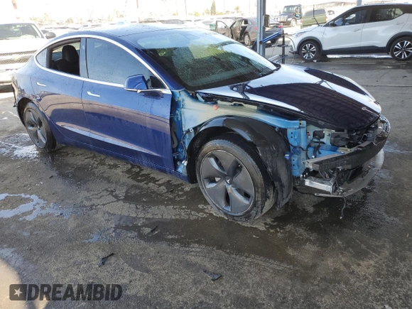 2020 Tesla Model 3 Standard Range Plus with VIN 5YJ3E1EA7LF705907, listed as a Copart auction lot 48765145 with 104,479 mi miles and Salvage Title. Bid and sale history available at DreamBid. Image 4.