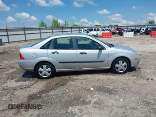 2007 Ford Focus S z VIN 1FAFP34N57W109953, wystawiony jako IAAI lot #42225399 z przebiegiem Nie podano mil oraz . Historia ofert i sprzedaży dostępna na DreamBid. Obrazek 13.