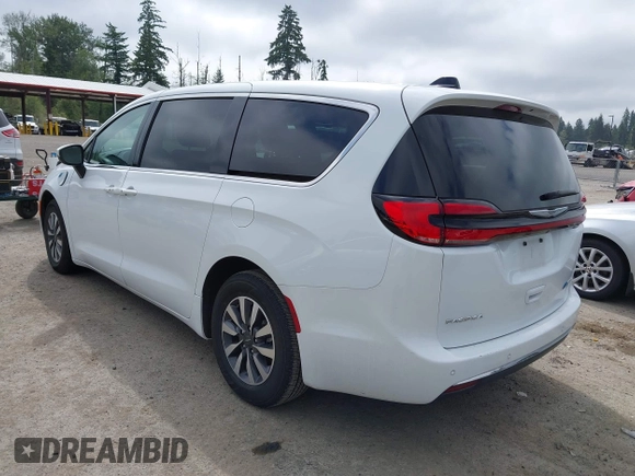 2023 Chrysler Pacifica Hybrid Touring L with VIN 2C4RC1L77PR541513, listed as a IAAI auction lot 42433421 with 53,979 mi miles and . Bid and sale history available at DreamBid. Image 3.
