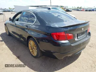 2013 BMW 5 Series 535i xDrive with VIN WBAFU7C51DDU73061, listed as a IAAI auction lot 41960663 with 106,591 mi miles and . Bid and sale history available at carsss.com. Image 3.