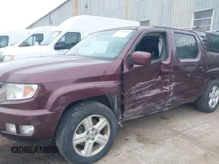 2011 Honda Ridgeline RTL with VIN 5FPYK1F51BB007959, listed as a IAAI auction lot 41894350 with 186,926 mi miles. Bid and sale history available at carsss.com. Image 6.